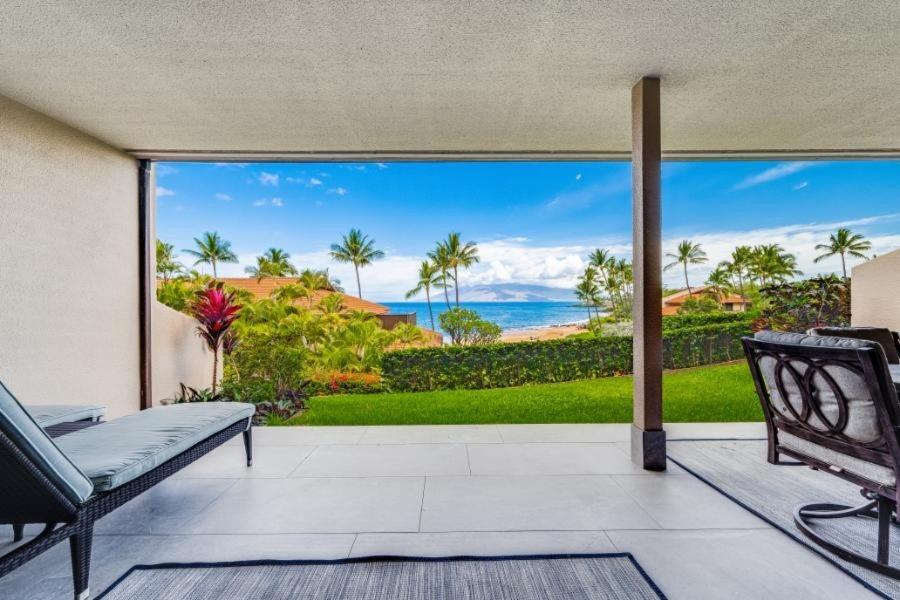 an open porch with a view of the ocean at MAKENA SURF #C102 condo in Wailea