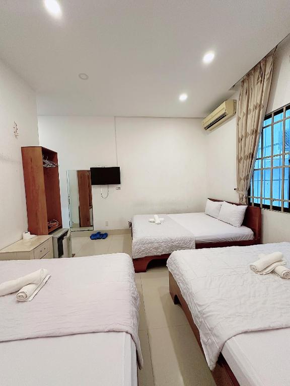 Postel nebo postele na pokoji v ubytování THIÊN ANH HOTEL