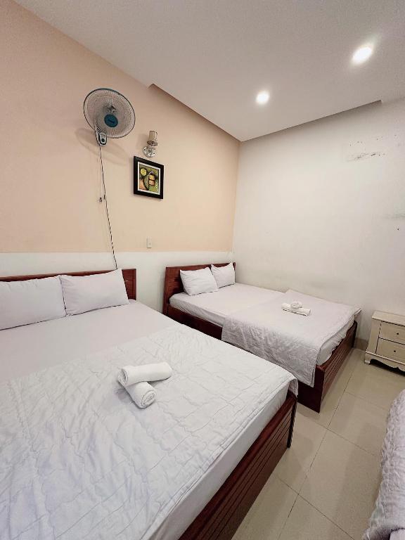 Postel nebo postele na pokoji v ubytování THIÊN ANH HOTEL