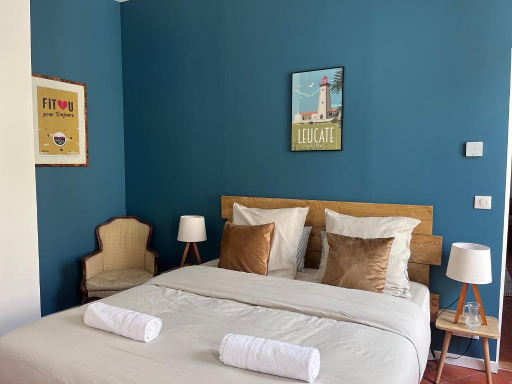 Postel nebo postele na pokoji v ubytování Abri du vent, chambres et appartements