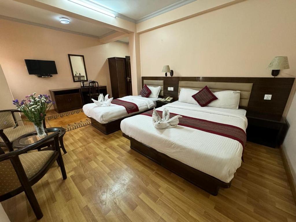 Postel nebo postele na pokoji v ubytování Hotel Namtso