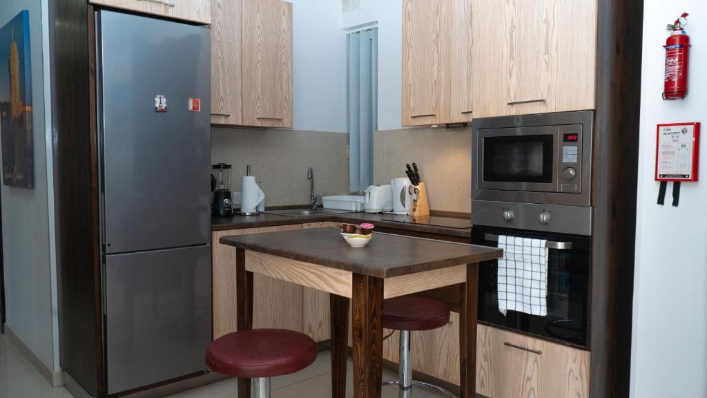Kuchyň nebo kuchyňský kout v ubytování Apartament in Ta' Xbiex 3BR- 3 min Yatch Marina