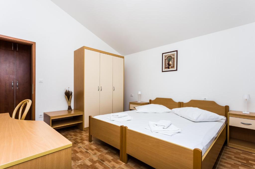 Postel nebo postele na pokoji v ubytování Villa Toni