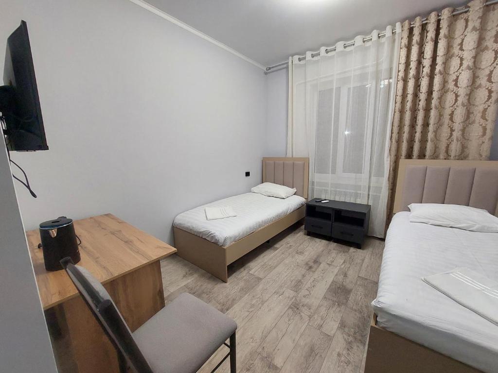 Postel nebo postele na pokoji v ubytování Bagysh Hotel