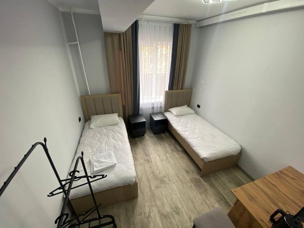 Postel nebo postele na pokoji v ubytování Bagysh Hotel