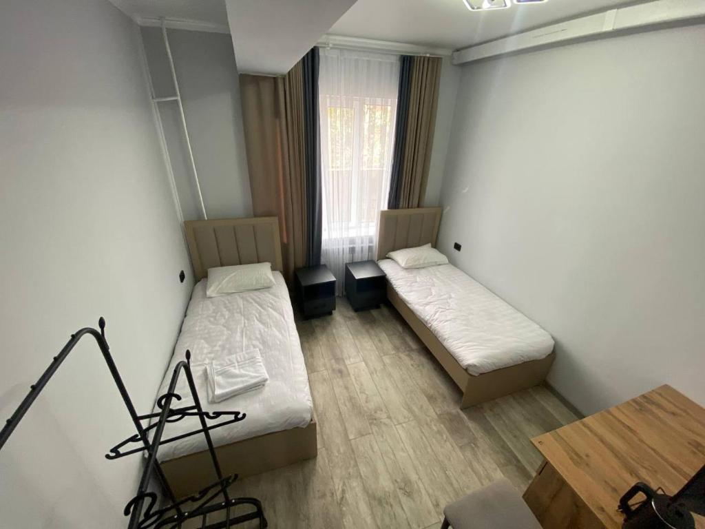 Postel nebo postele na pokoji v ubytování Bagysh Hotel
