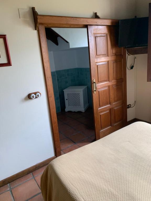 A bed or beds in a room at Posada El Jardin de Angela