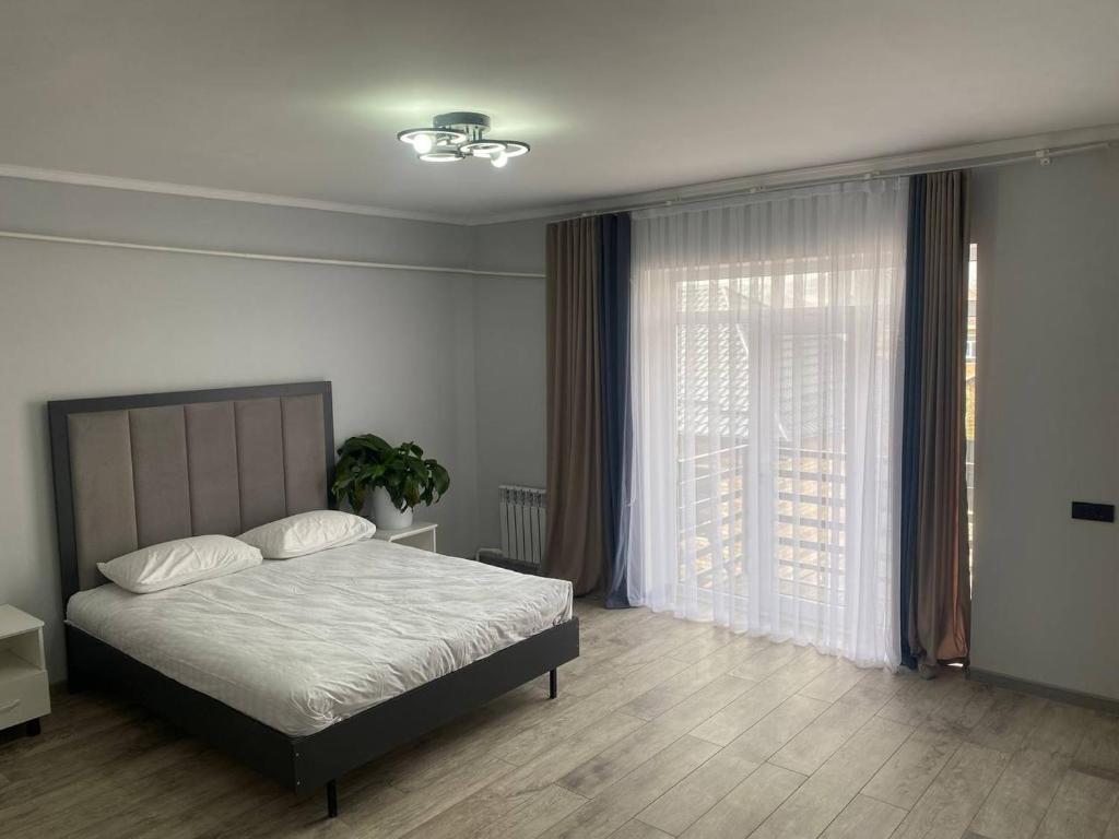 Postel nebo postele na pokoji v ubytování Bagysh Hotel