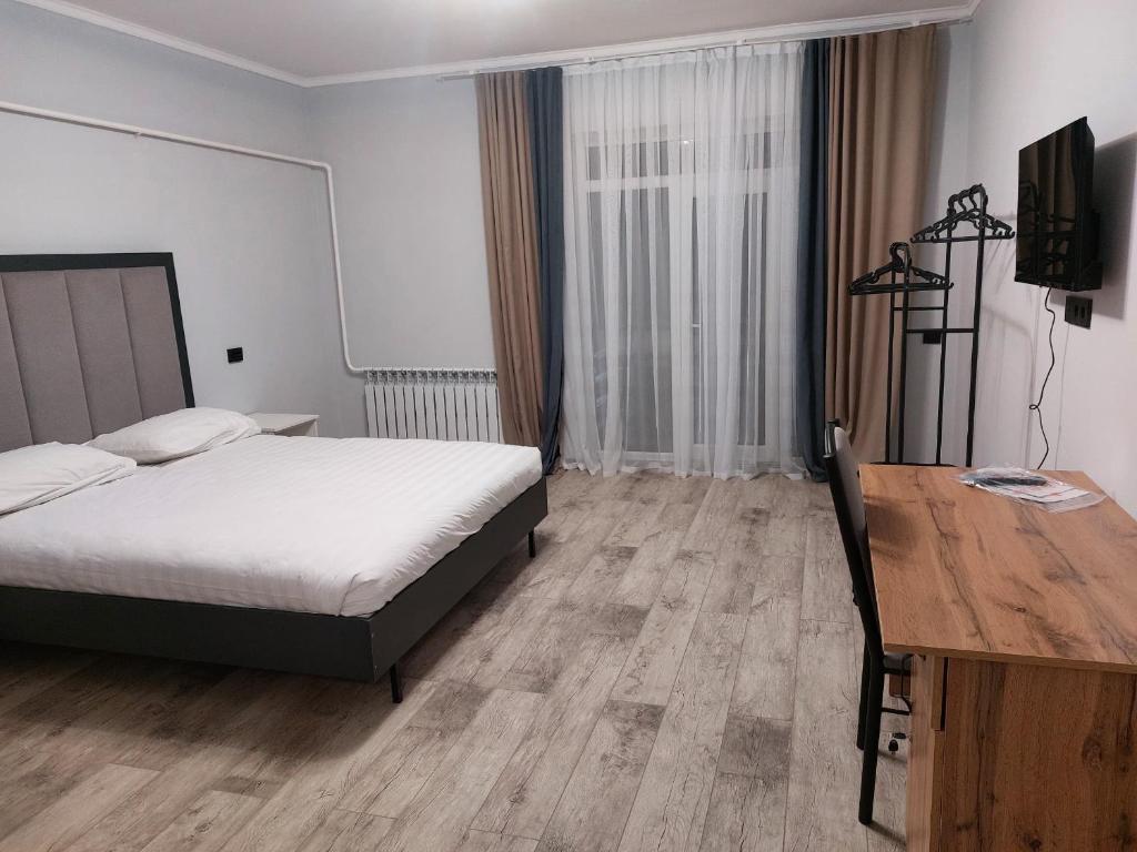 Postel nebo postele na pokoji v ubytování Bagysh Hotel