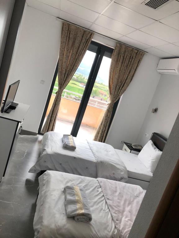 Postel nebo postele na pokoji v ubytování Hotel Albatros