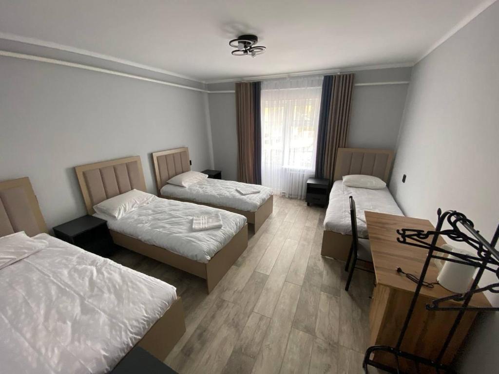 Postel nebo postele na pokoji v ubytování Bagysh Hotel