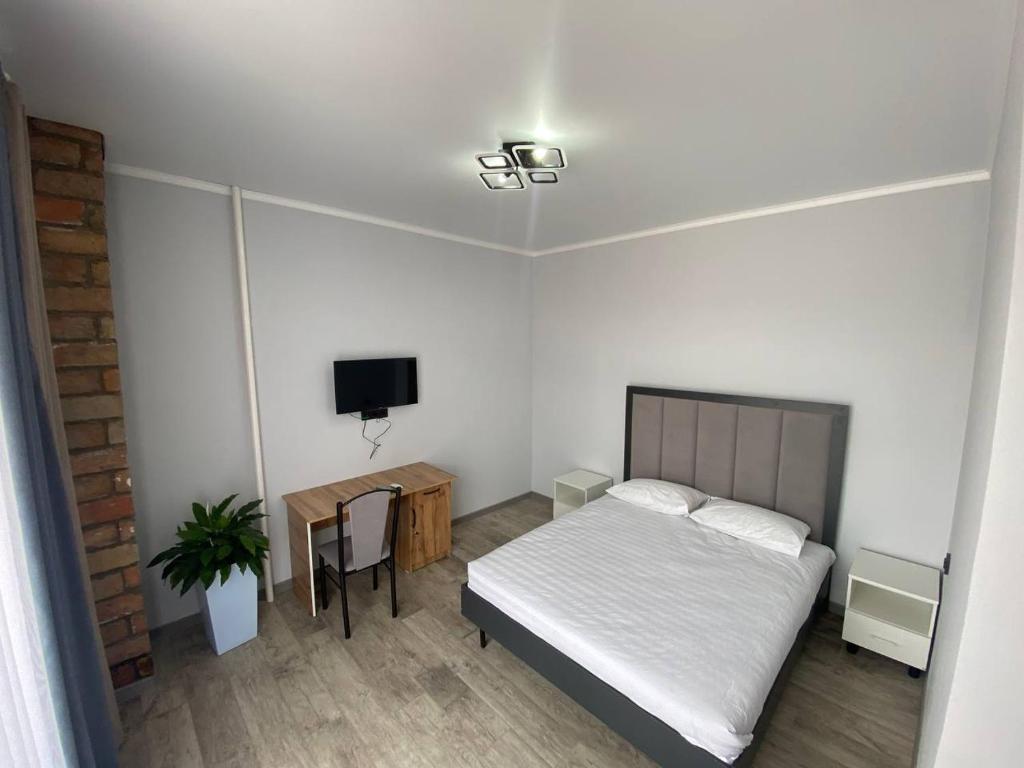 Postel nebo postele na pokoji v ubytování Bagysh Hotel