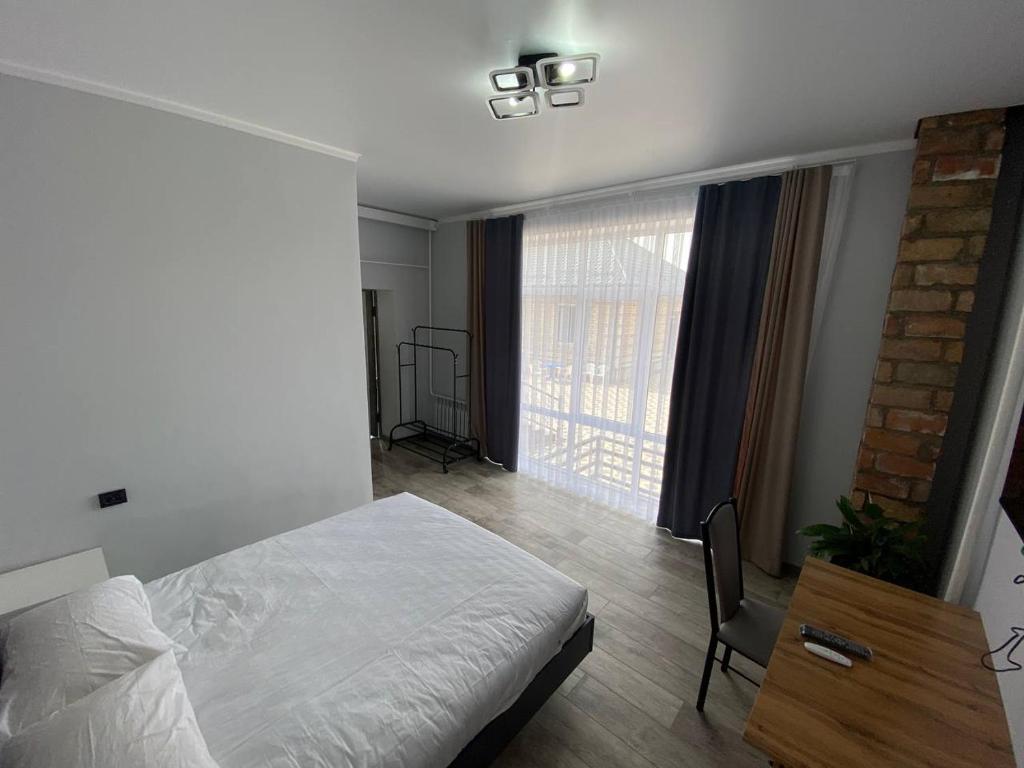 Postel nebo postele na pokoji v ubytování Bagysh Hotel