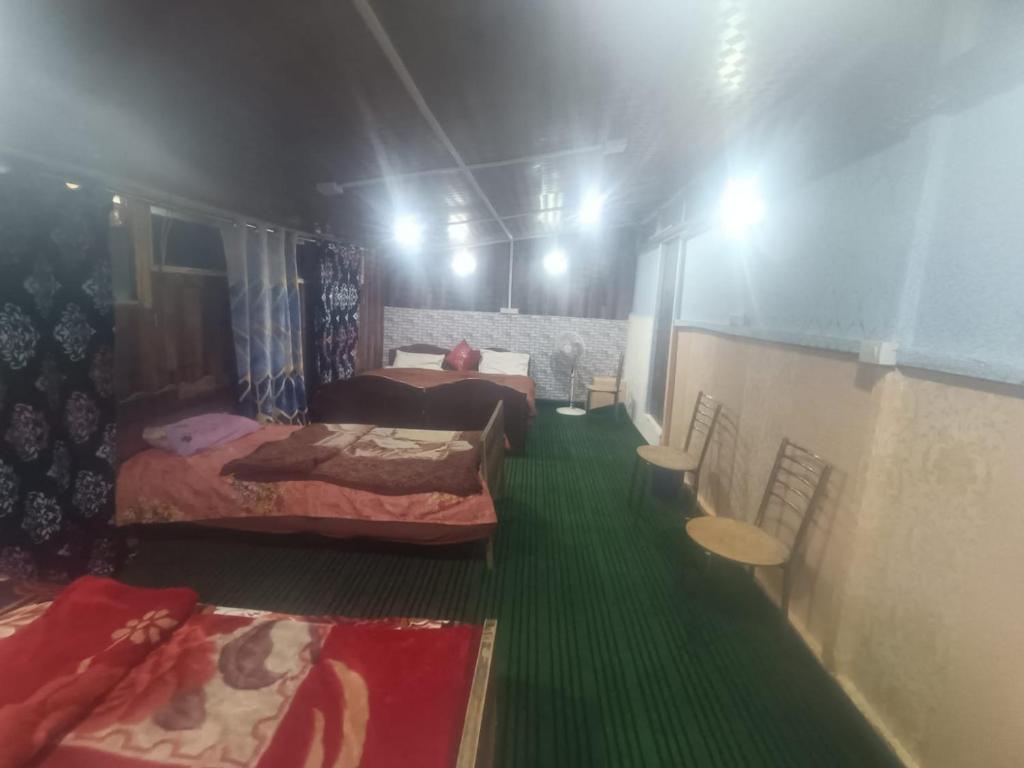 Postel nebo postele na pokoji v ubytování Shamus Javed Homestay