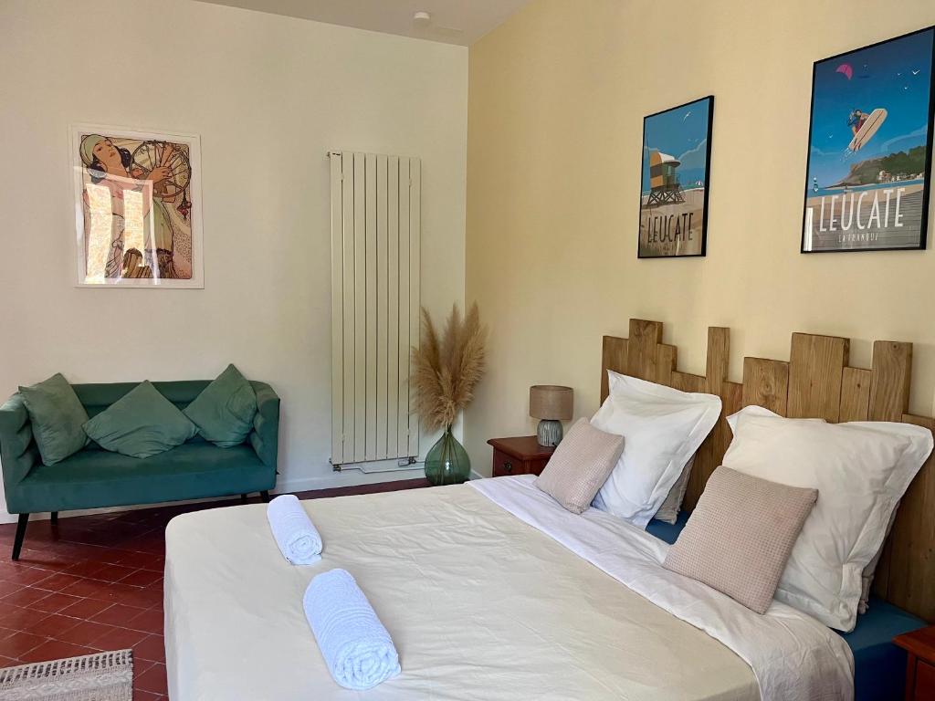 Postel nebo postele na pokoji v ubytování Abri du vent, chambres et appartements