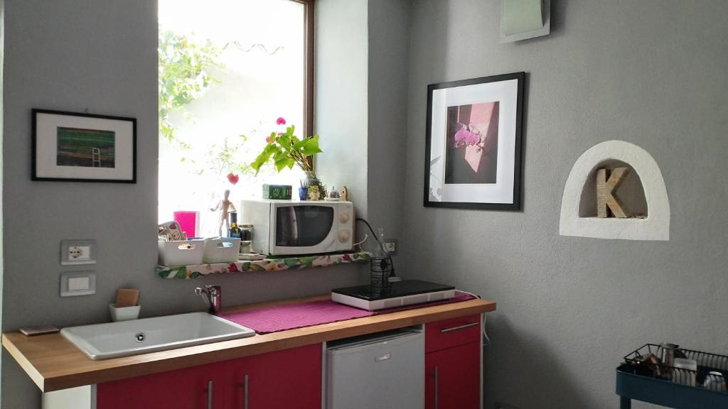 Kuchyň nebo kuchyňský kout v ubytování B&B BIANCALUNA