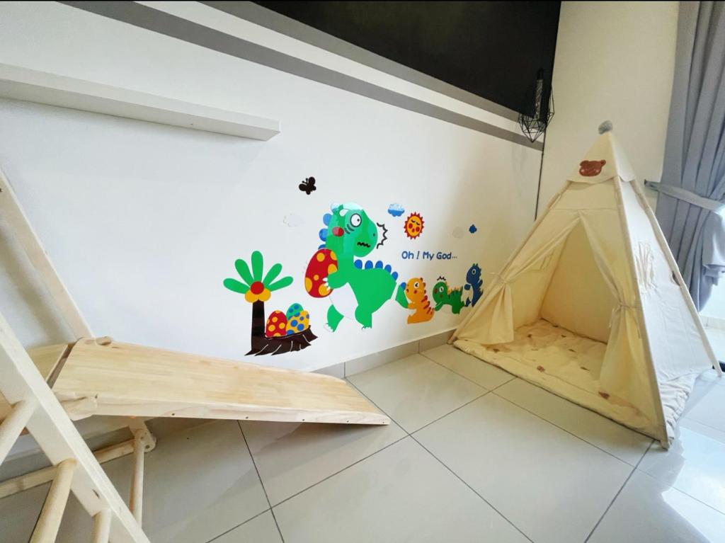 a childs room with a dinosaur wall decal at Meridin Medini Near Legoland 5min in Johor Bahru
