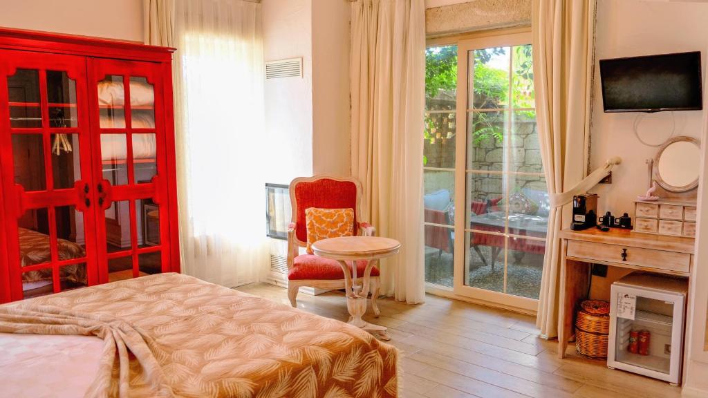 Postel nebo postele na pokoji v ubytování CASA RUBİNO BUTİK OTEL