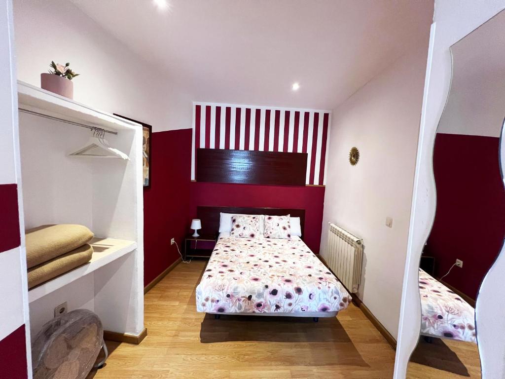 A bed or beds in a room at Hostal Abaaly