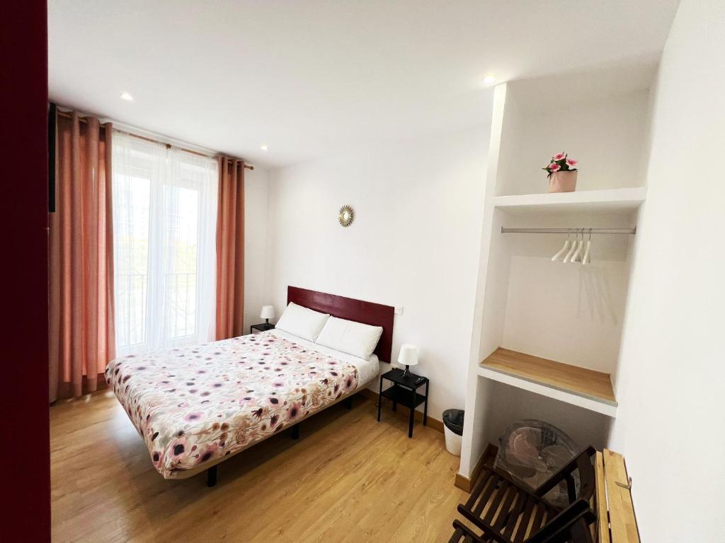 A bed or beds in a room at Hostal Abaaly