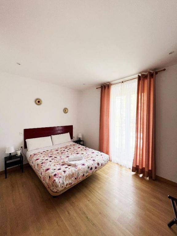 A bed or beds in a room at Hostal Abaaly