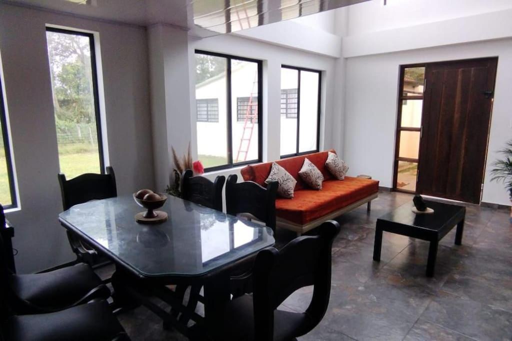 a living room with a couch and a table at Eco - Rincón Albergue natural in Moniquirá