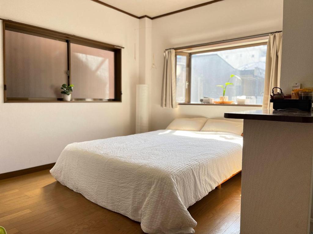 Katil atau katil-katil dalam bilik di ᛃ 眠りの癒 ᛃ Cozy Apt In The Heart of Beppu 201