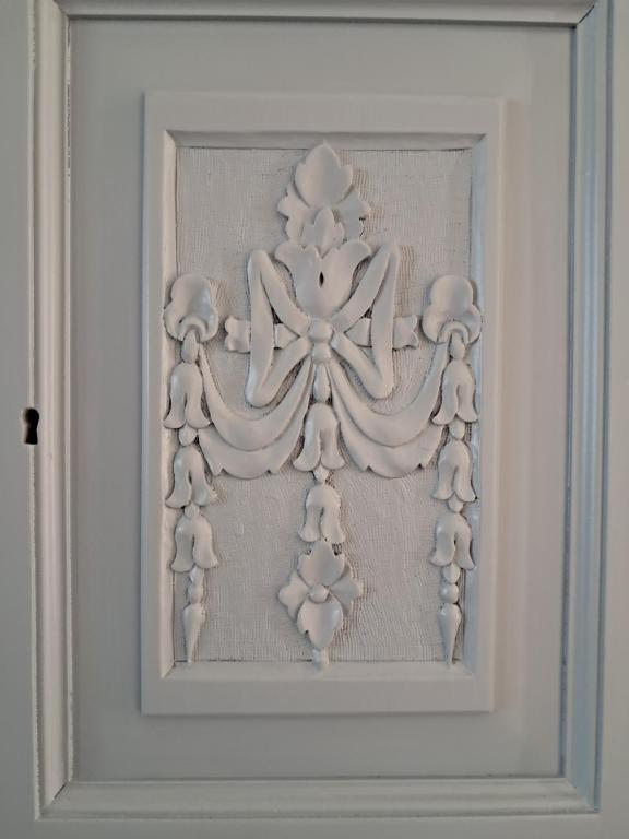 a framed picture of a flower on a wall at Yatrissa Boutique Apartments in Kalymnos