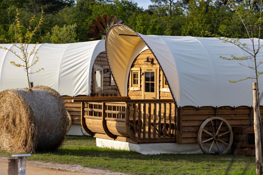 a cabin in a yurt with hay at O'Tel Park in Le Bernard