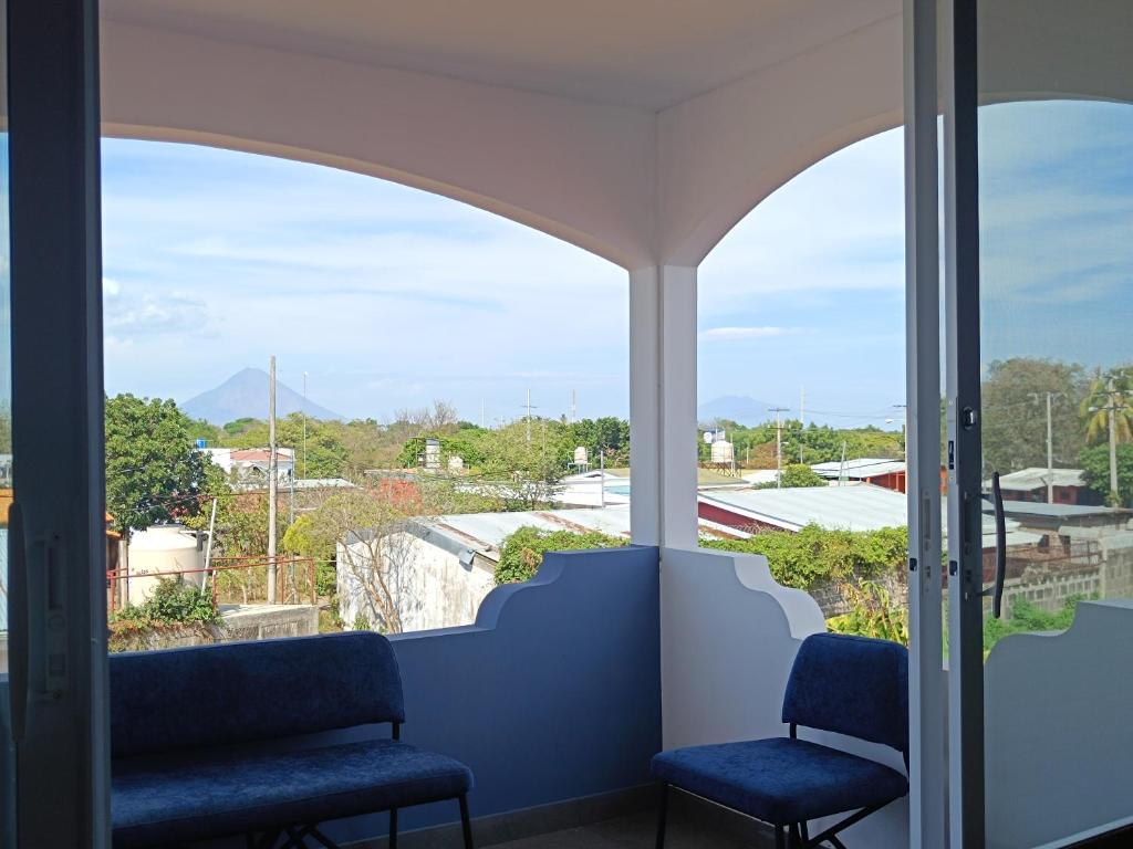 a view from the balcony of a hospital with two chairs at Confortable apartamento in Rivas