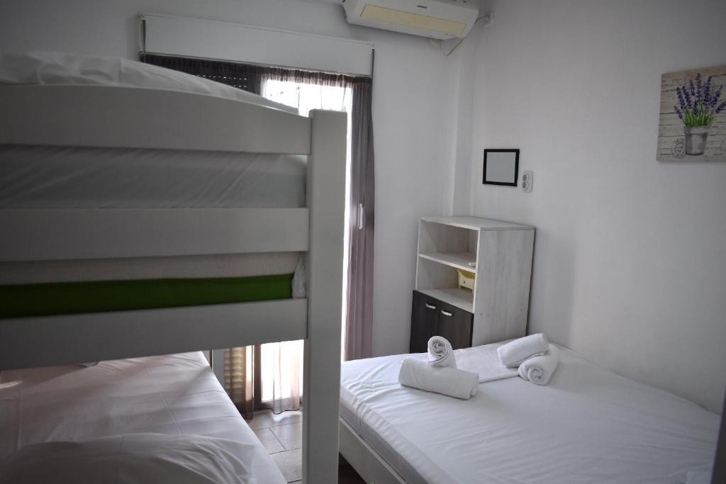 Postel nebo postele na pokoji v ubytování New Apartment Nea Kalikratia Chalkidiki near beach