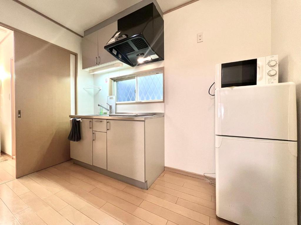 Kuchyň nebo kuchyňský kout v ubytování AX-Asaka House