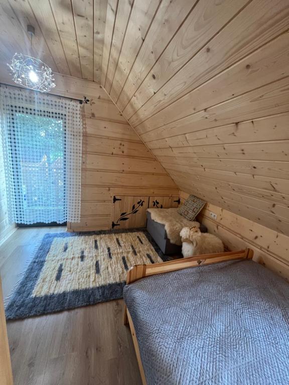 Posteľ alebo postele v izbe v ubytovaní Mazury "Willa Ślimakowo" w Pasymiu z jakuzzi, sauną, pomostem