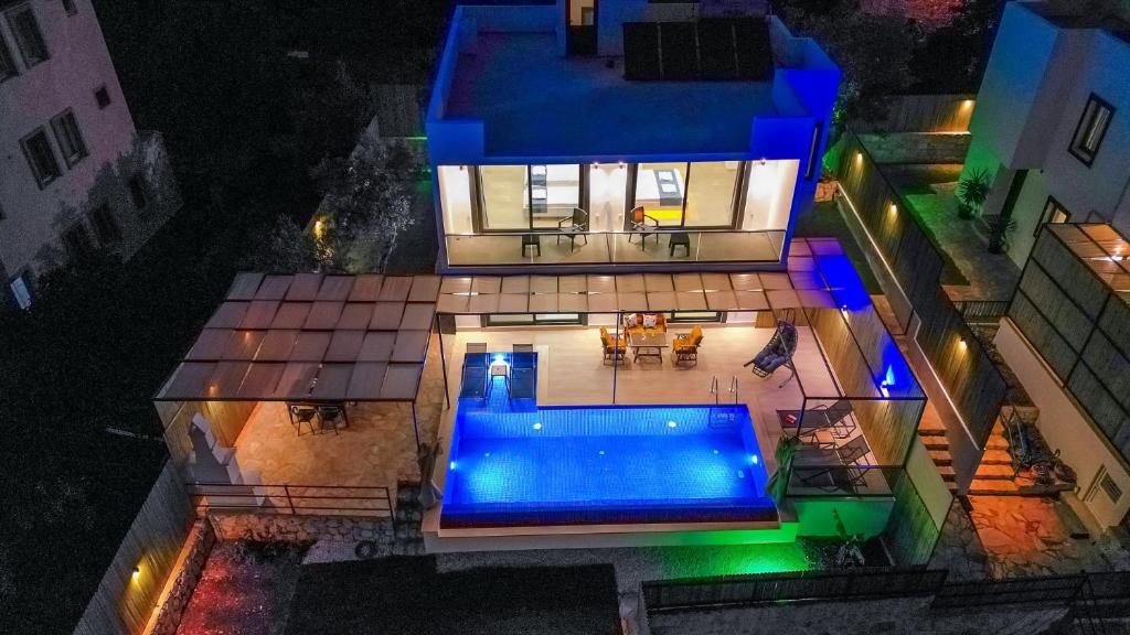 an aerial view of a house with a swimming pool at Villa Albedo Blue in Kaş