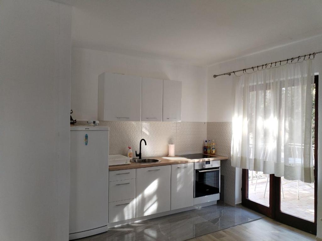 Kuchyň nebo kuchyňský kout v ubytování Mondeno apartments