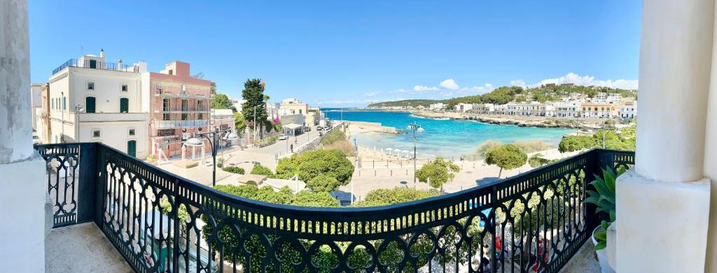 a balcony with a view of a river and buildings at Tramonto in Santa Maria al Bagno