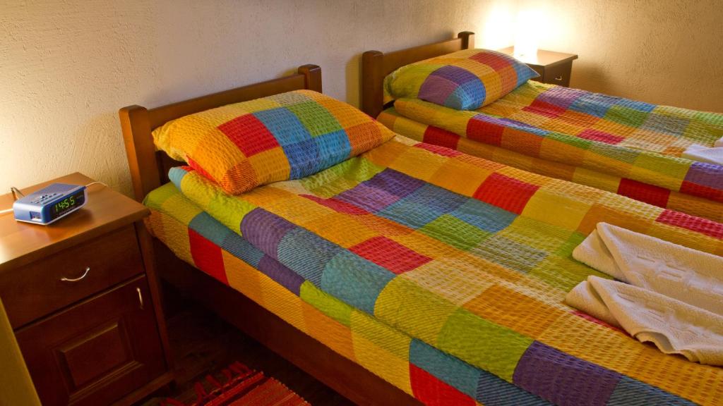 Postel nebo postele na pokoji v ubytování Apartments Peaks