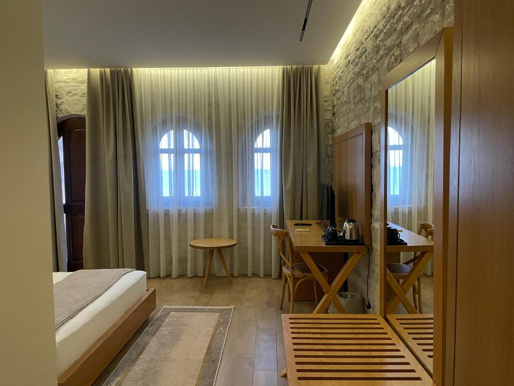 Postel nebo postele na pokoji v ubytování Valta Hotel