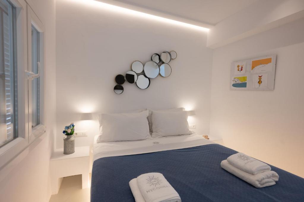 Postel nebo postele na pokoji v ubytování Hyades - Downtown Suites, Mykonos Town