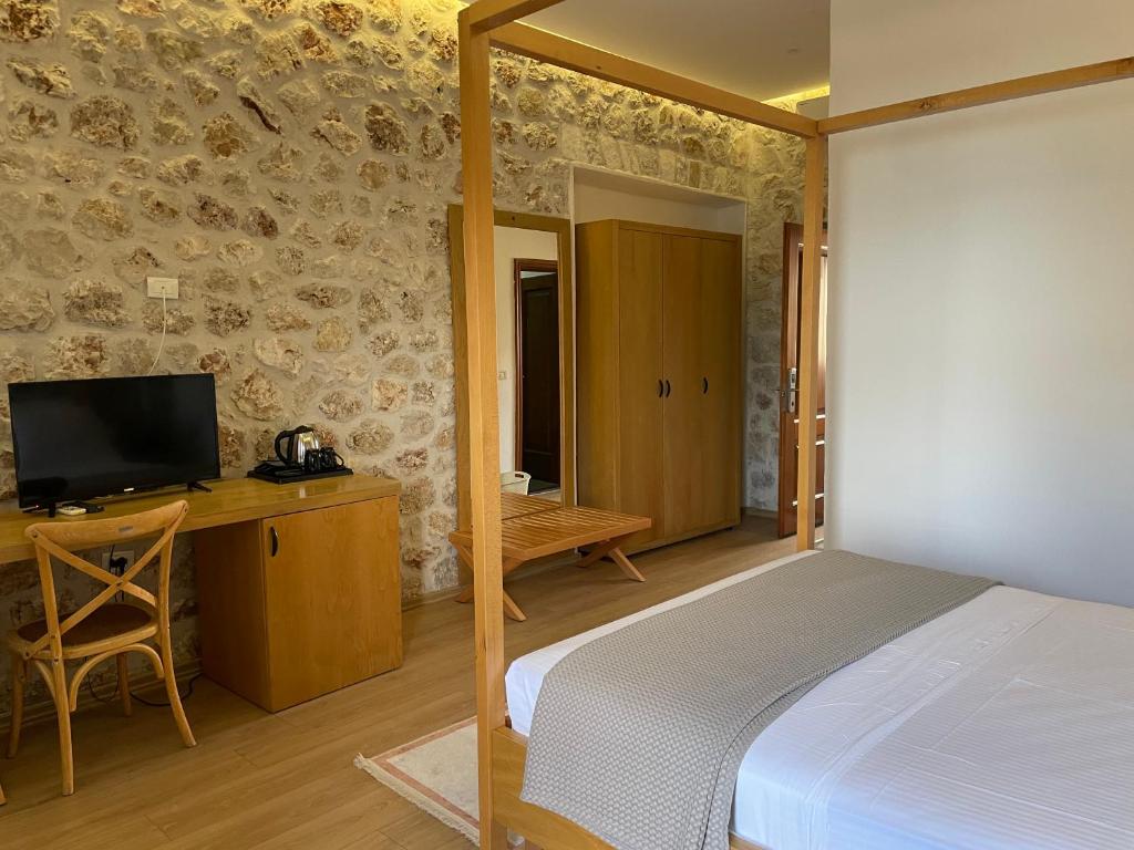 TV a/nebo společenská místnost v ubytování Valta Hotel
