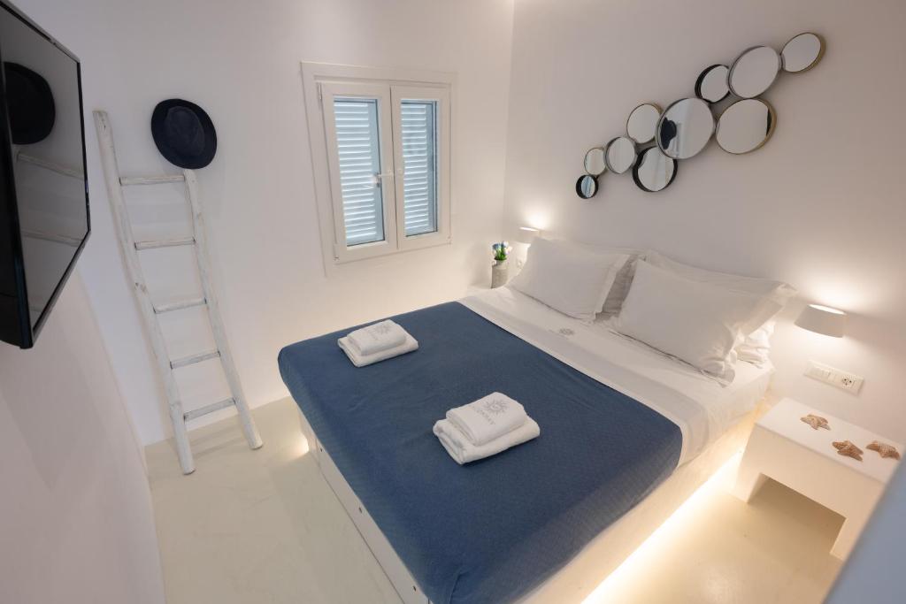 Postel nebo postele na pokoji v ubytování Hyades - Downtown Suites, Mykonos Town
