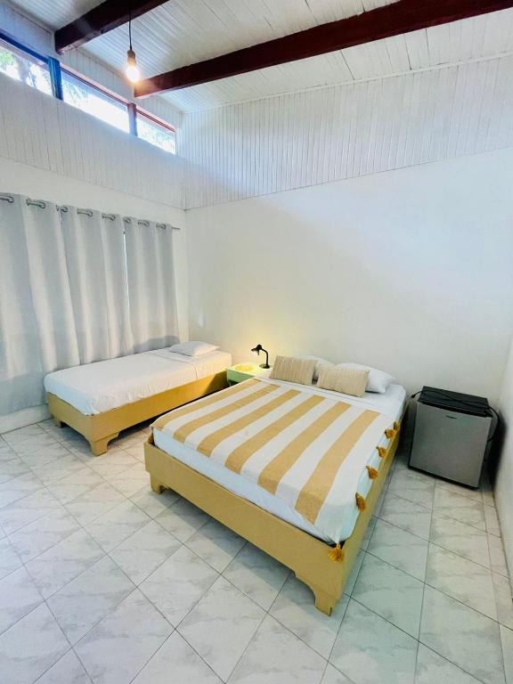 Postel nebo postele na pokoji v ubytování Hotel Exotic Lodge