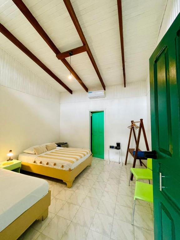 Postel nebo postele na pokoji v ubytování Hotel Exotic Lodge