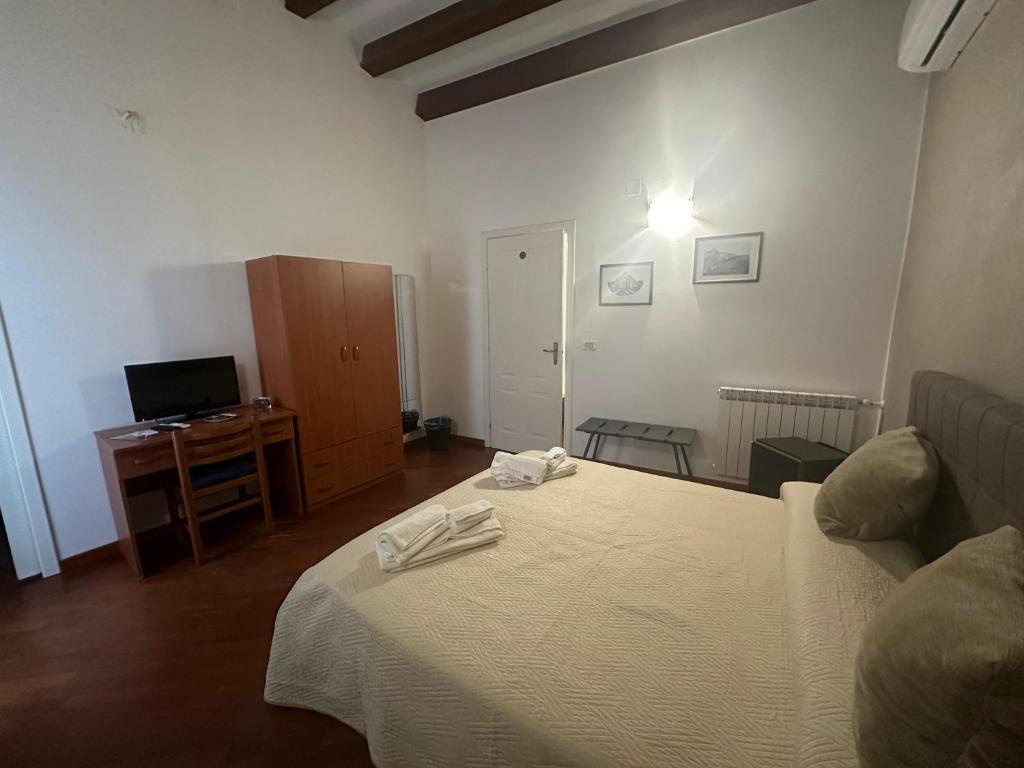 Postel nebo postele na pokoji v ubytování Affittacamere Resalibera