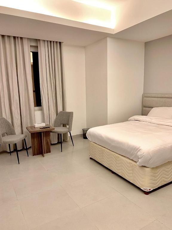 Postel nebo postele na pokoji v ubytování Iveria Hotel Apartments