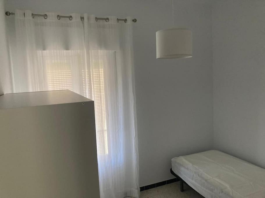 Postel nebo postele na pokoji v ubytování Piso céntrico en Moguer