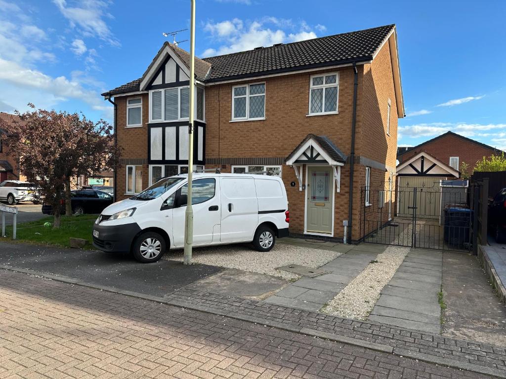 a white van parked in front of a house at Hinckley Home Leysmill in Hinckley