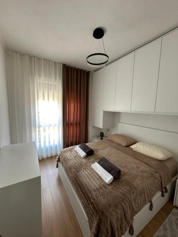 Ένα ή περισσότερα κρεβάτια σε δωμάτιο στο M'apartment1