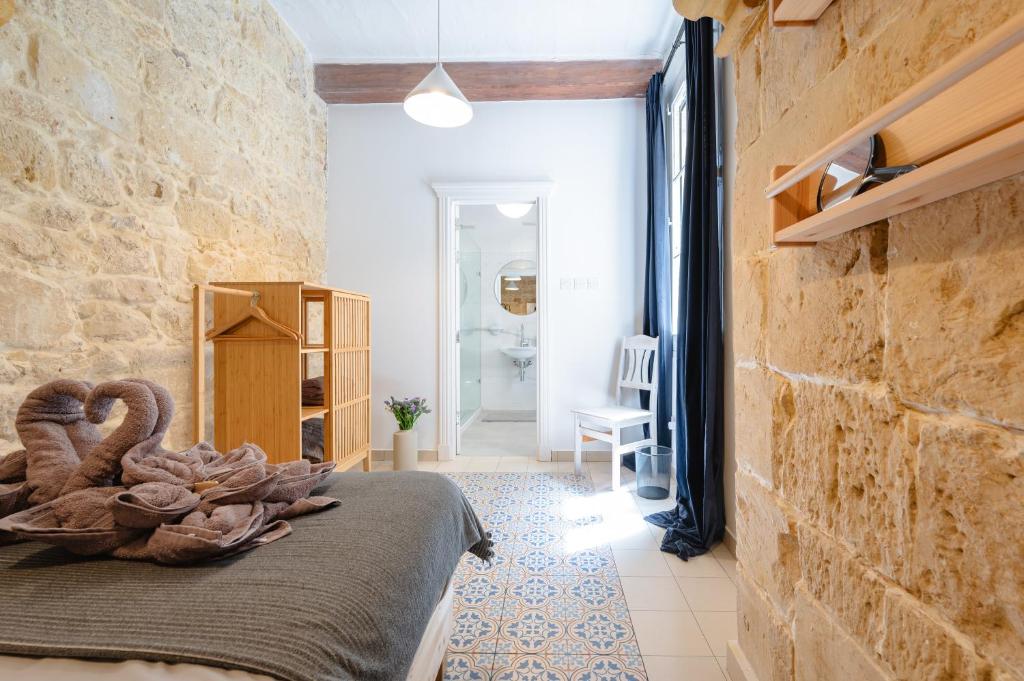 Postel nebo postele na pokoji v ubytování 'Notabile' - Private Townhouse in Mdina