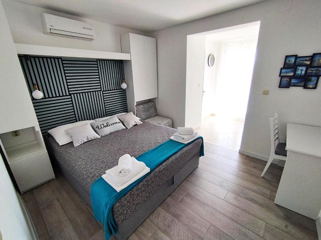 Postel nebo postele na pokoji v ubytování Anita Apartments